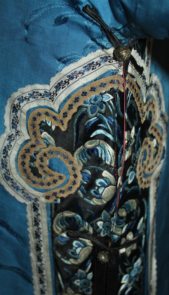 A Chinese blue silk, damask and embroidered ladys robe, late 19th / early 20th century,